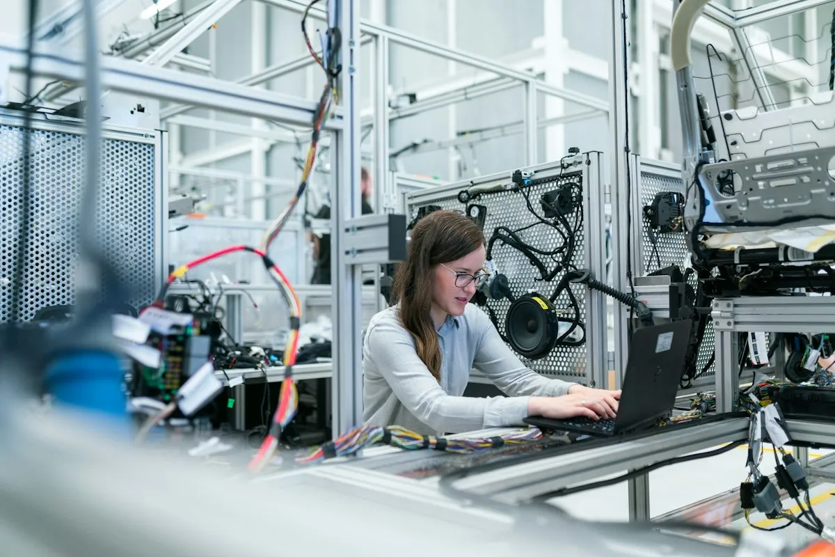 Technology worker configuring equipment in an engineering lab