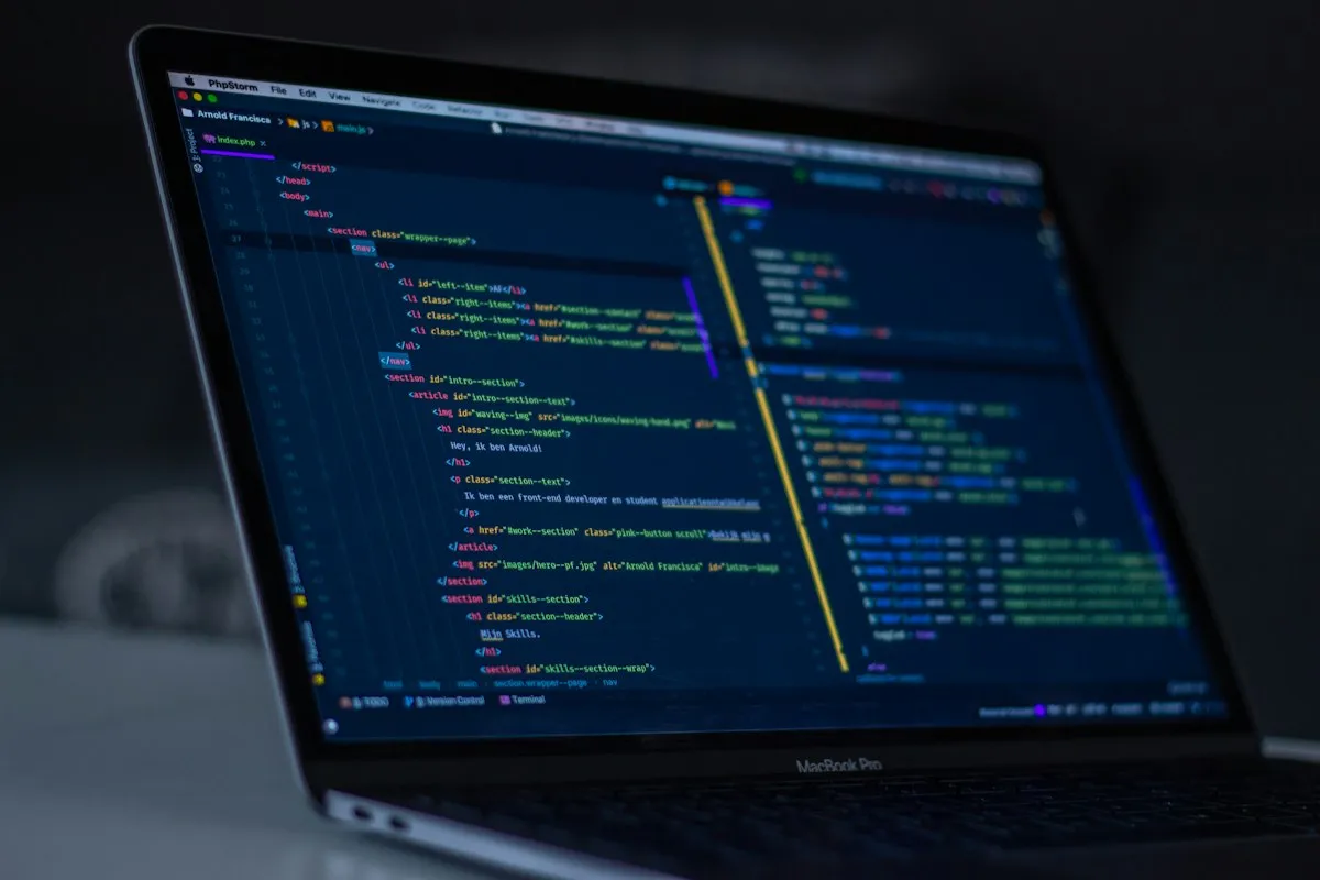 Laptop displaying application code for a technical review