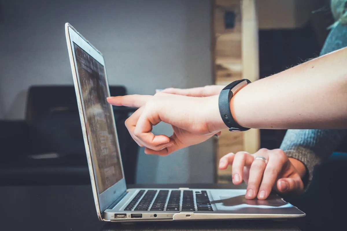 Technology professional connecting systems on a laptop